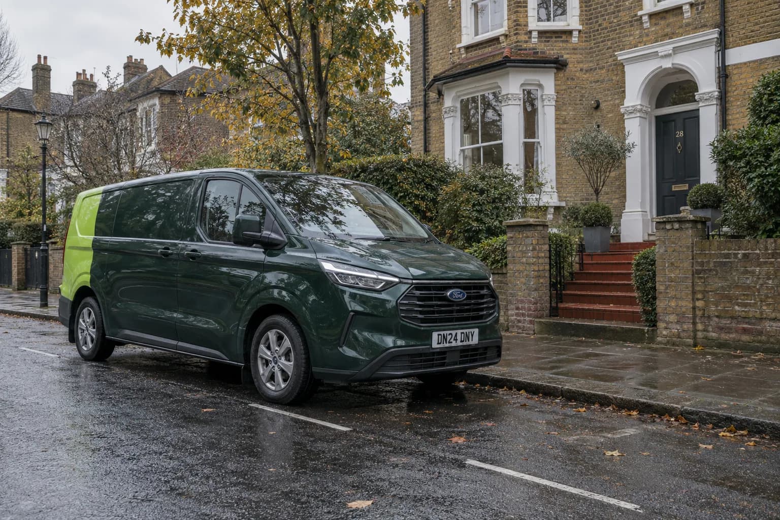 Dark-green service van arriving outside a North London home on an overcast day